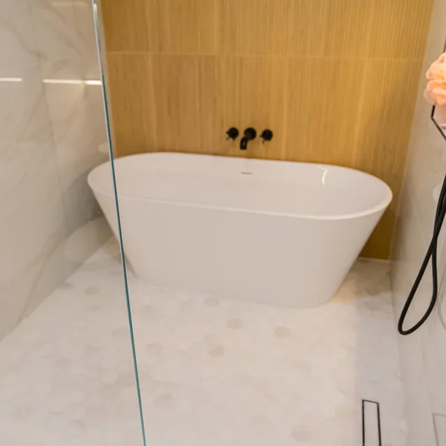 Freestanding tub & marble hex tile