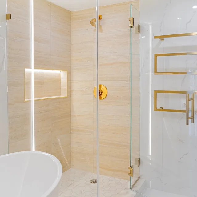 Walk-in shower with brass fixtures